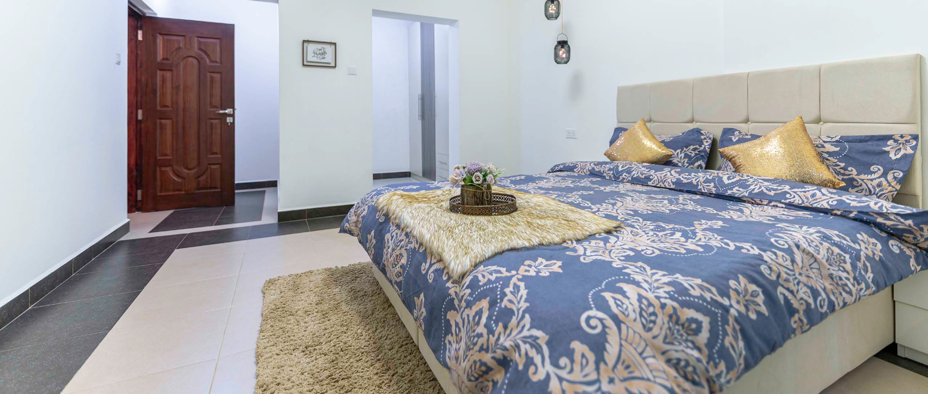 Bright bedroom with a patterned bedspread