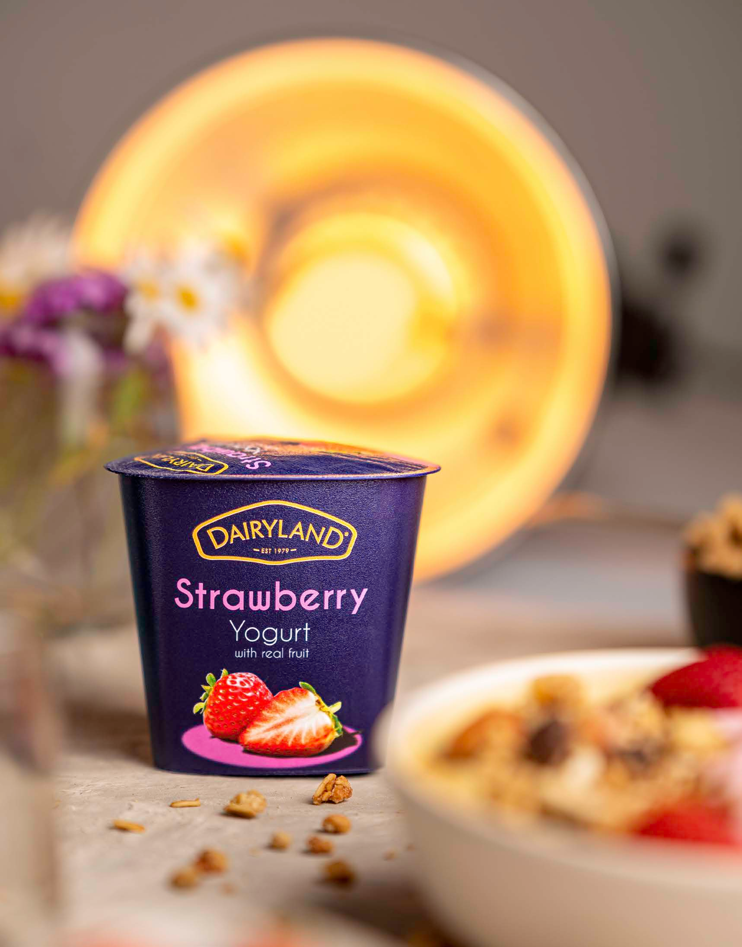 Product photograph of a dessert cup with a golden lid