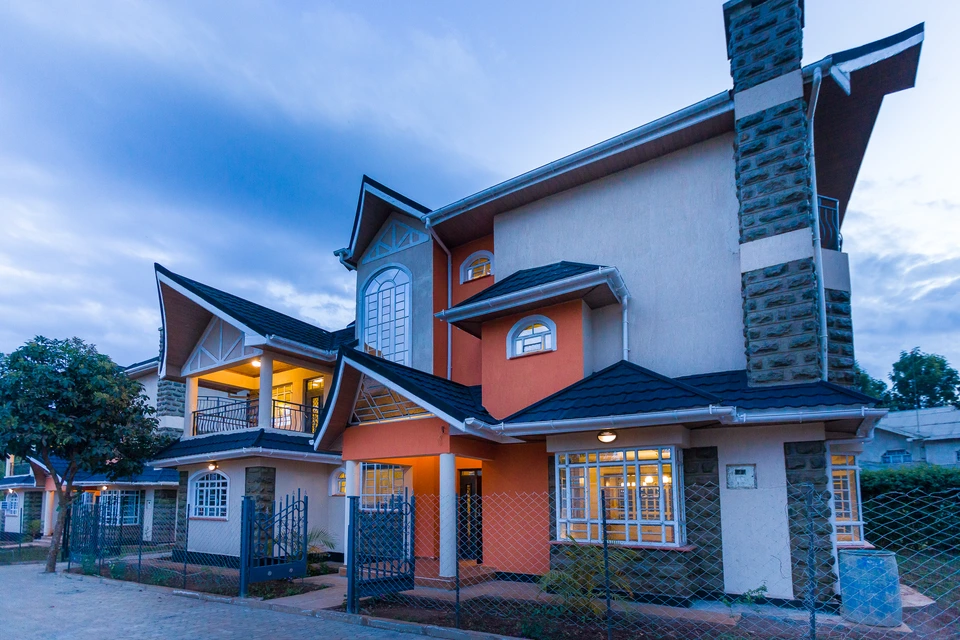 Contemporary house photographed at dusk with illuminated windows