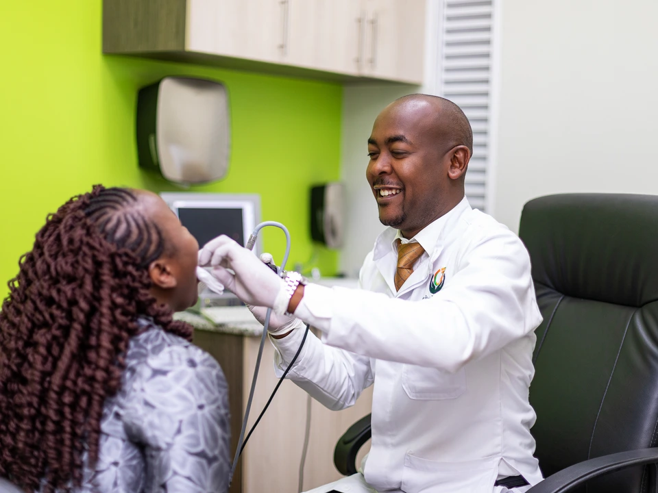 Healthcare professional examining a patient in a bright consulting room