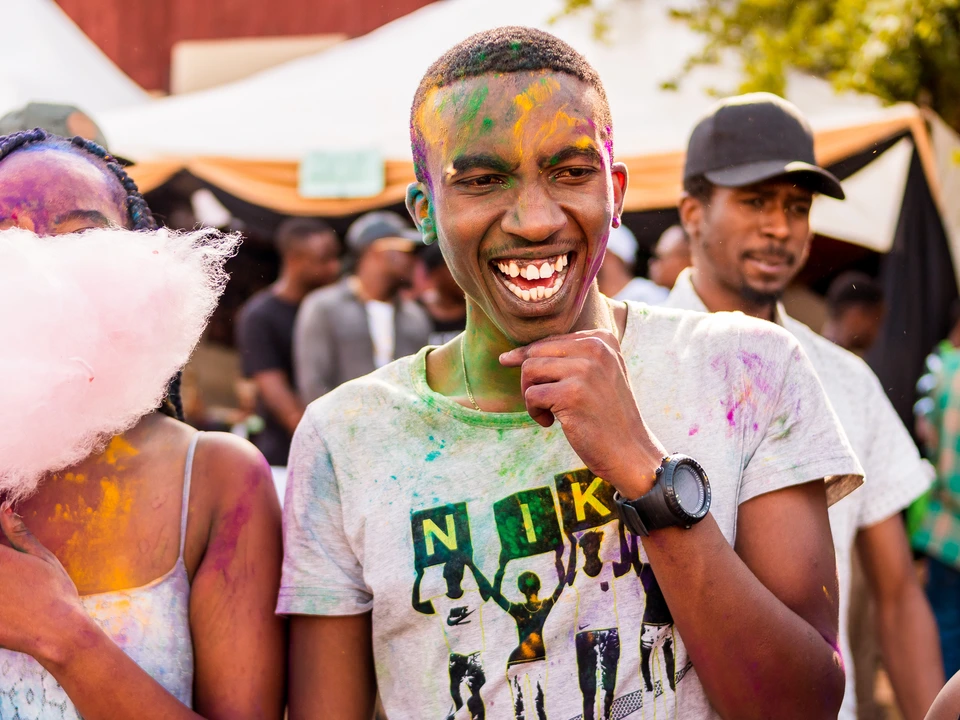 Smiling participant at a lively outdoor event