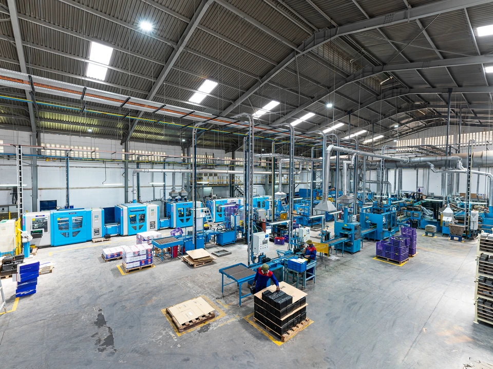 Wide view across a large industrial production floor