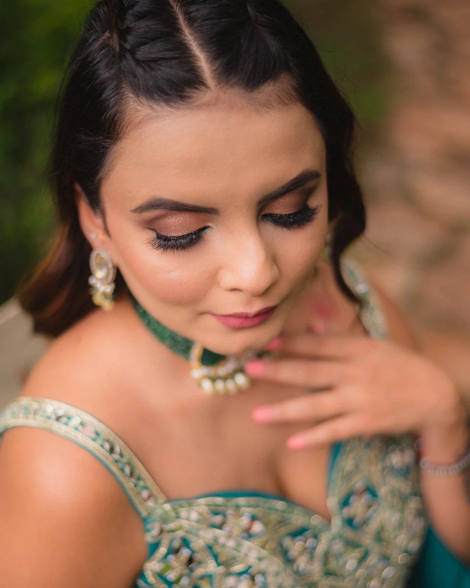 Close portrait of a bride looking down at her jewellery