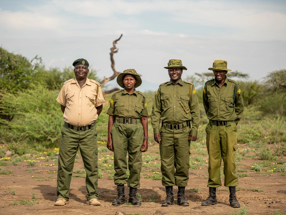 Group portrait of people in ranger uniforms outdoors